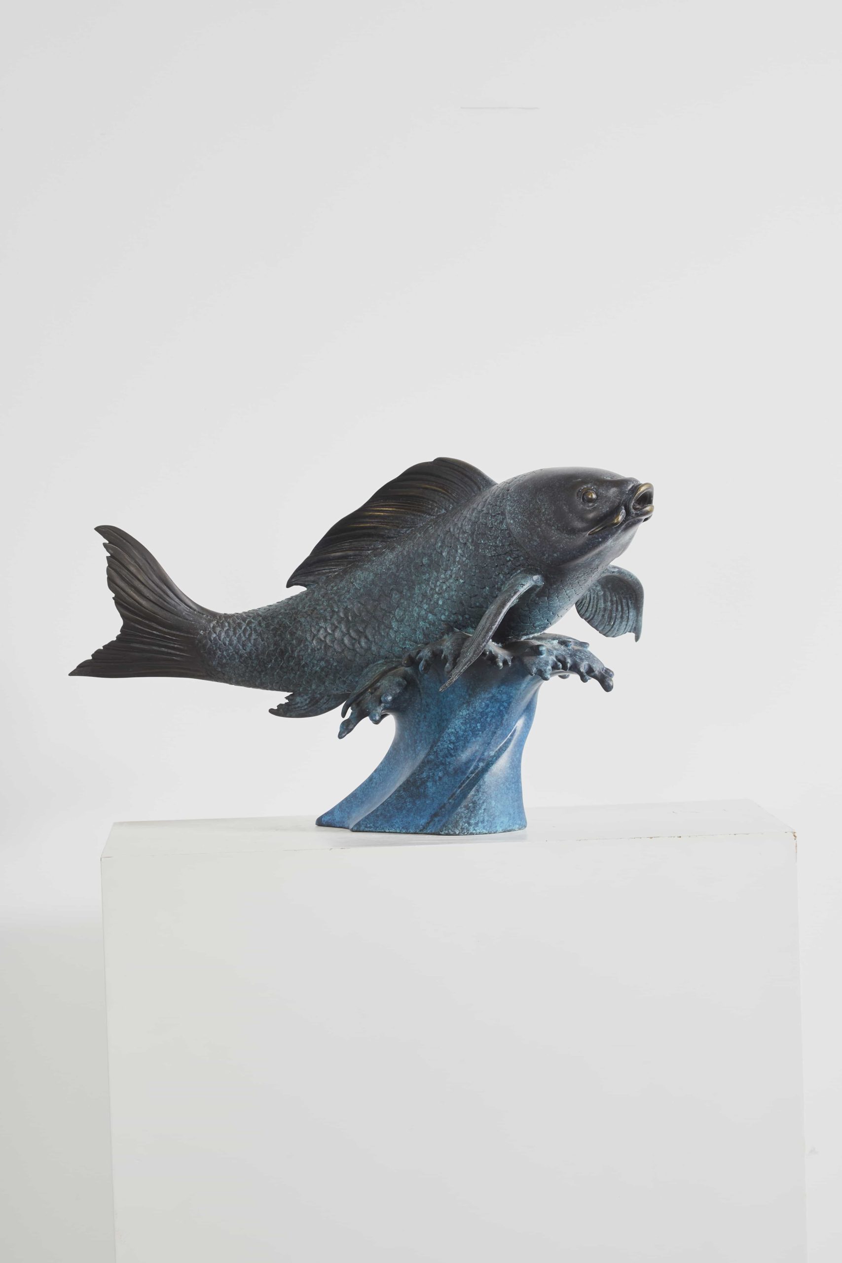 Carp leaping over turquoise wave — three-quarter alt.