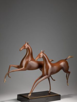 Two horses running side by side