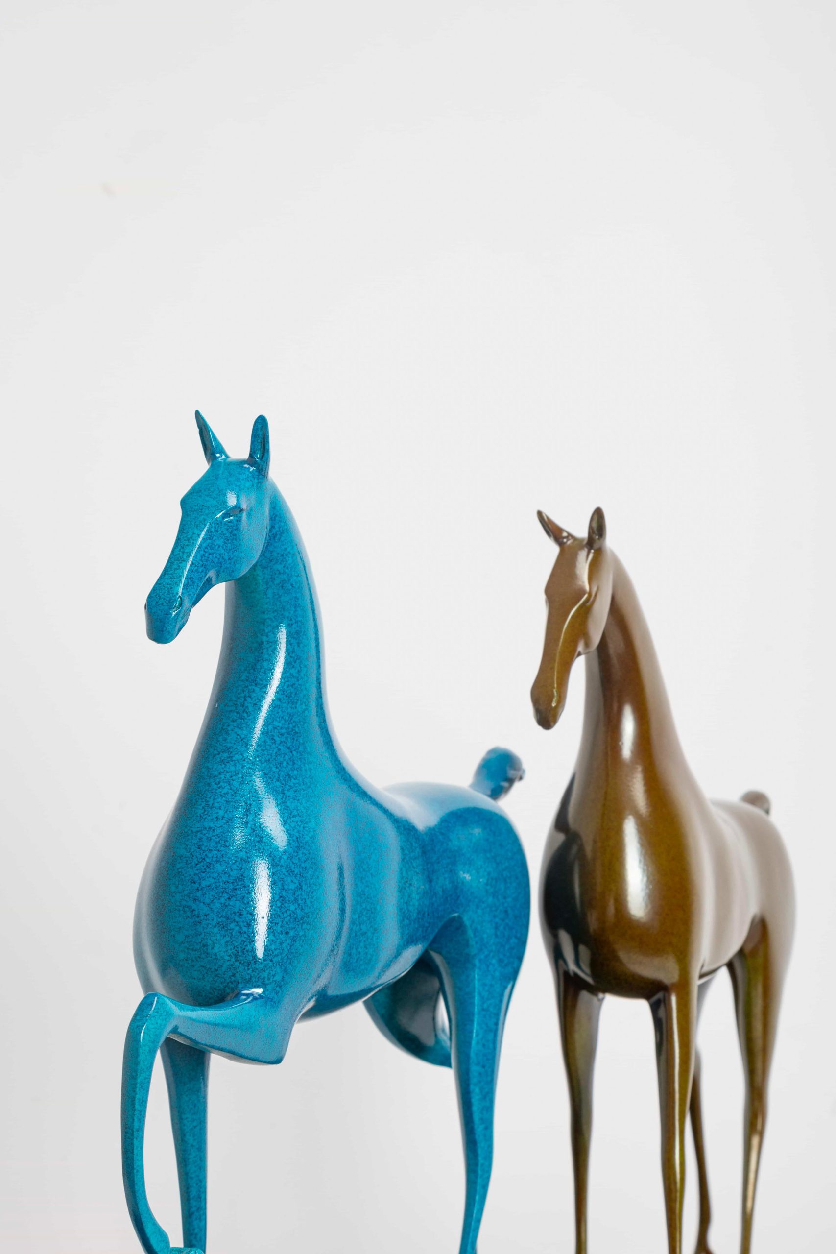 Running horse pair in turquoise and gold — front view pair.