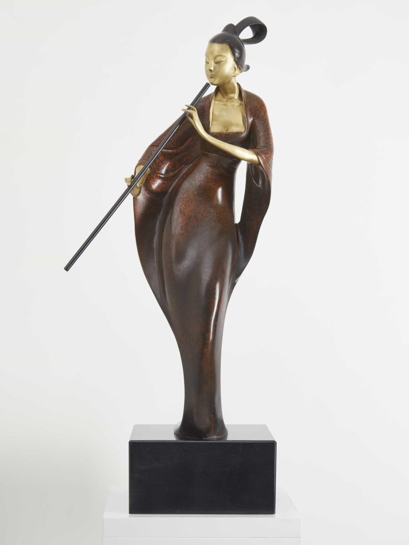 The woman playing the flute