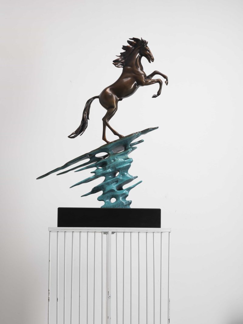 A horse jumping against the wind