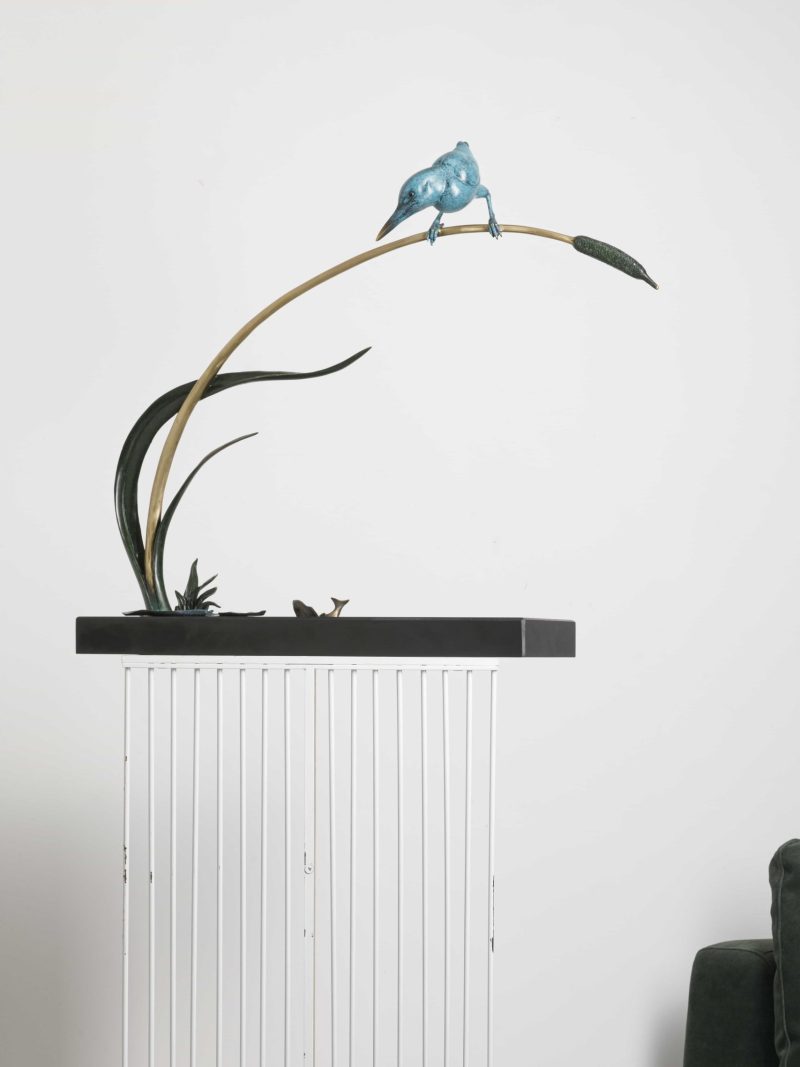 The bird standing among the reeds