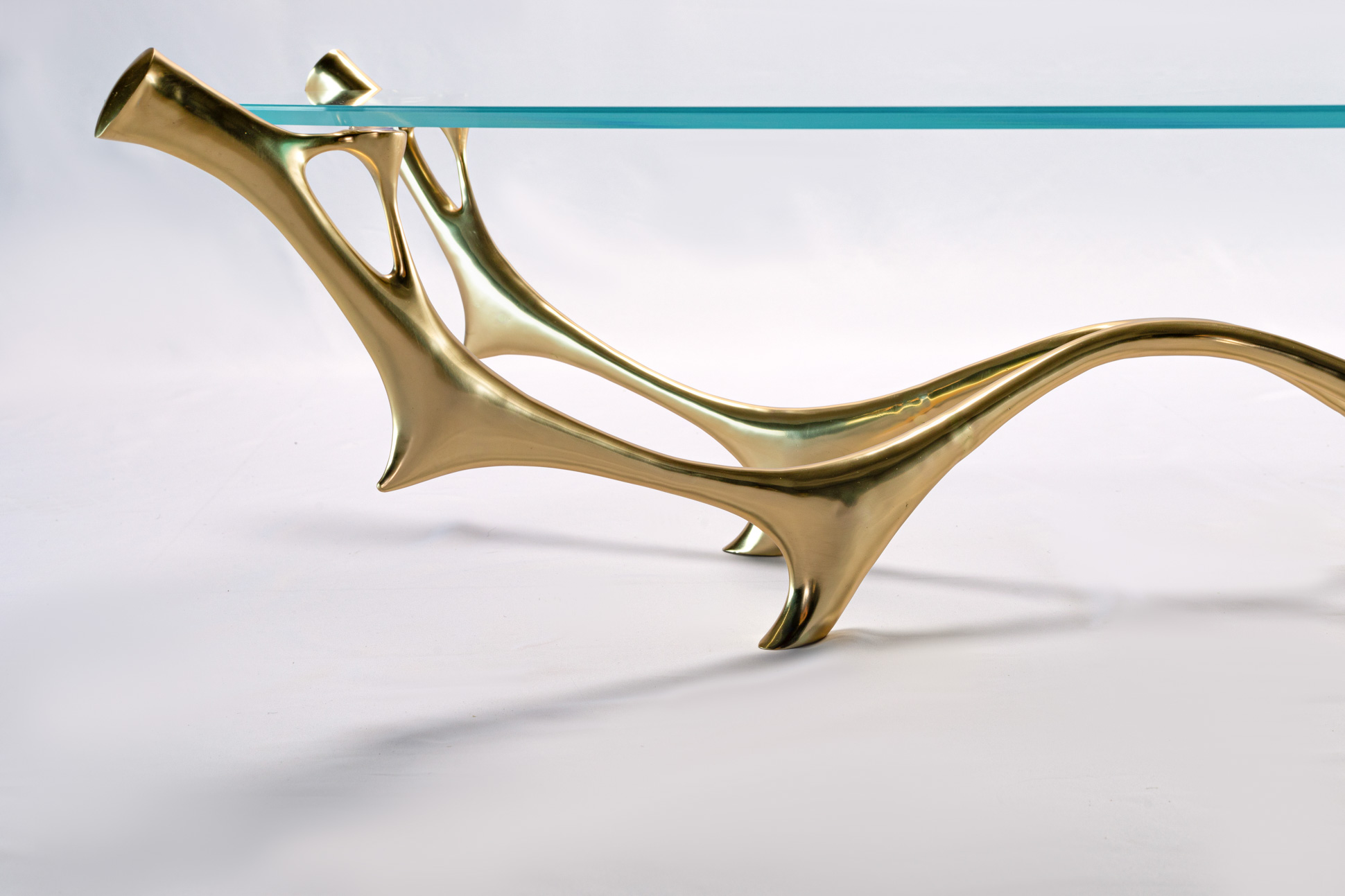 Close-up of the sculpted bronze branch leg of the coffee table