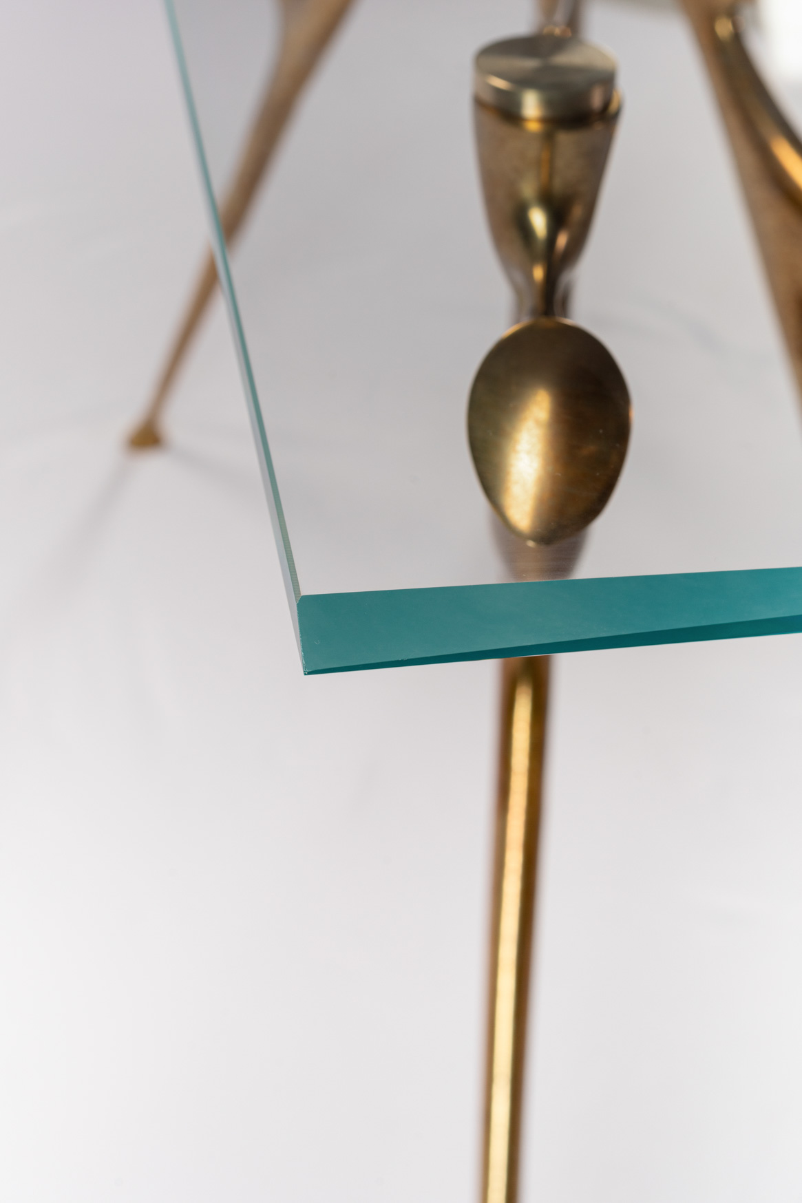 Close-up of the bronze foot of the console table