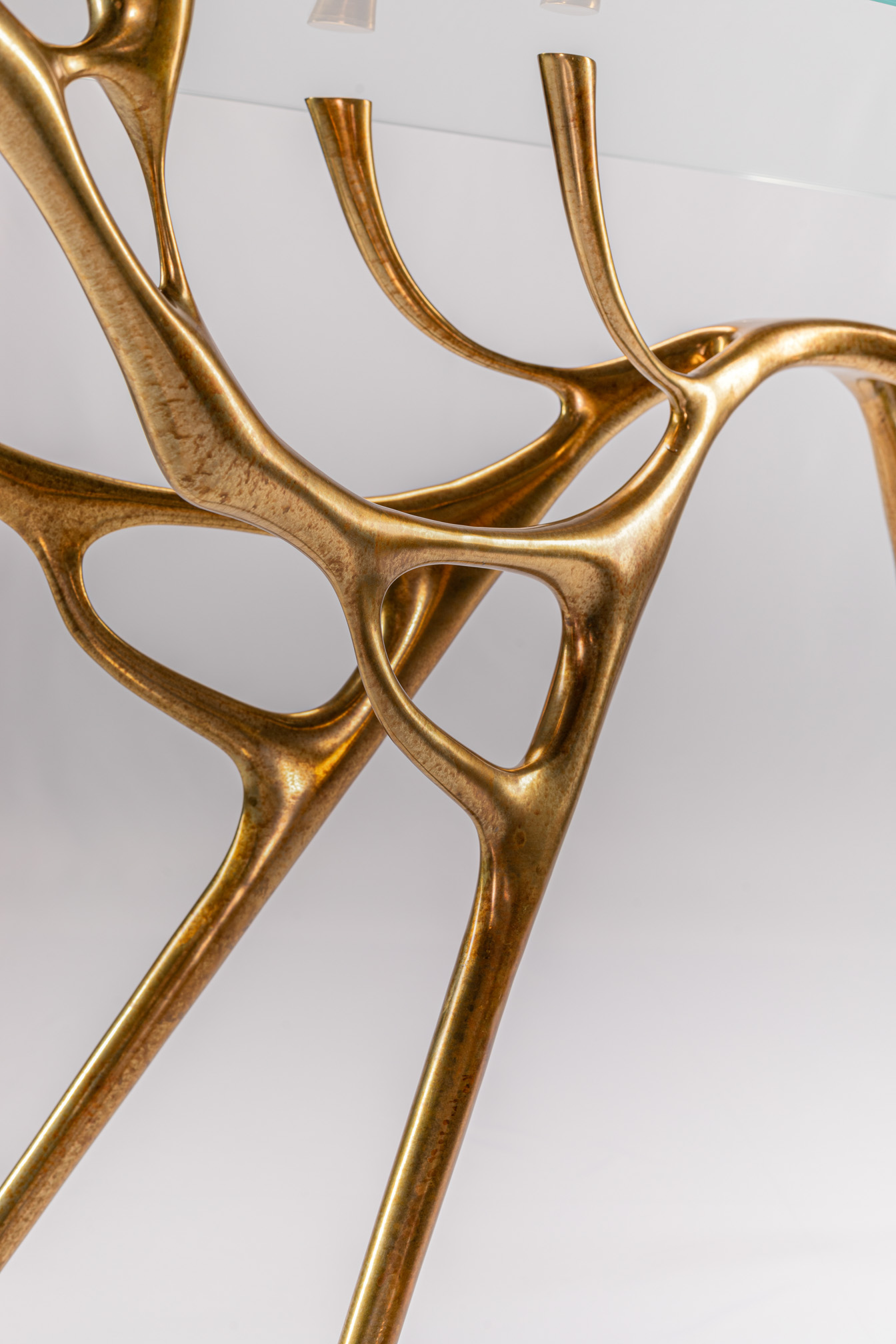 Detail of the abstract water-and-branch bronze form