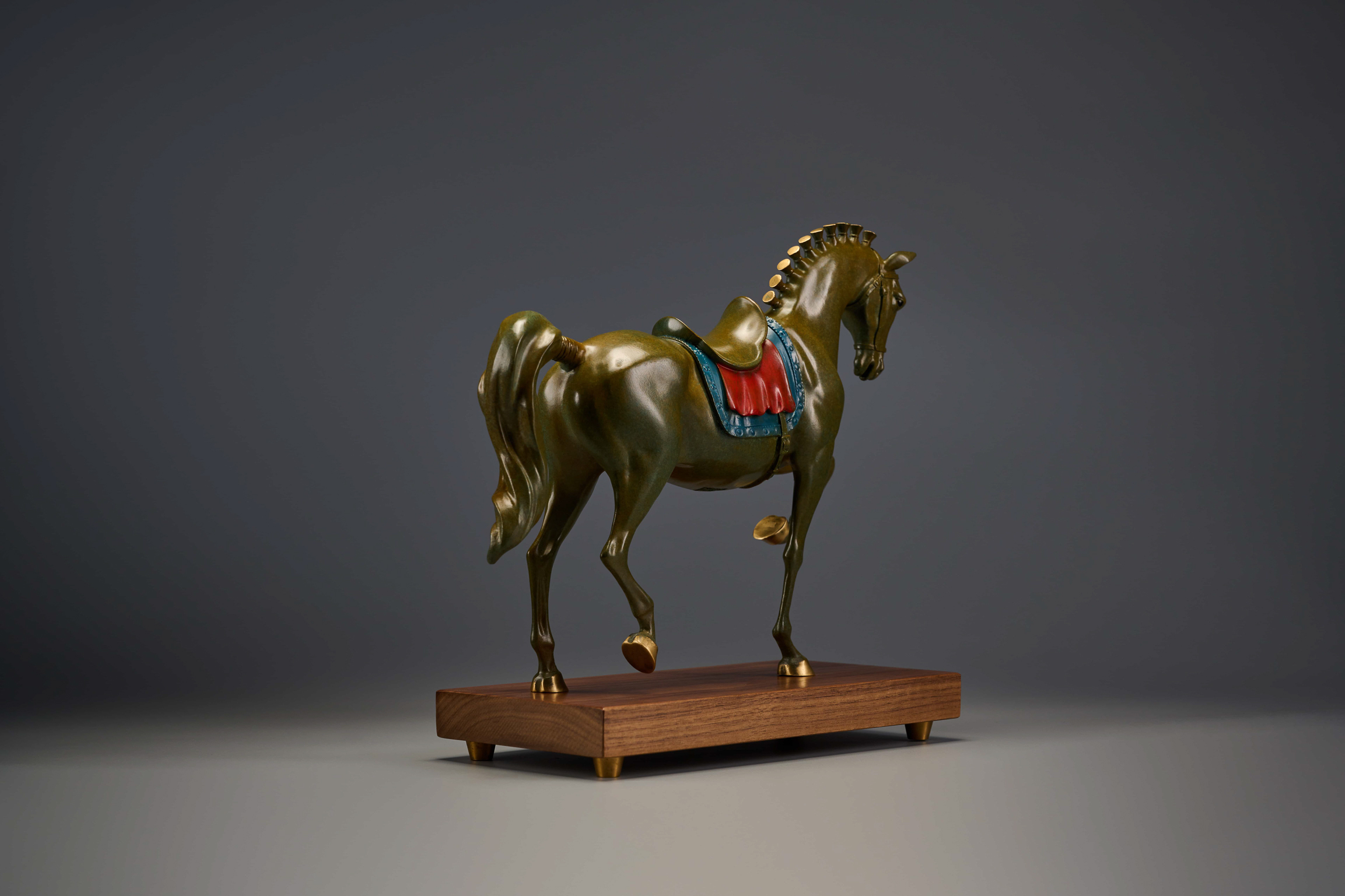 Reddish-brown tang-style horse with painted saddle — rear three-quarter.