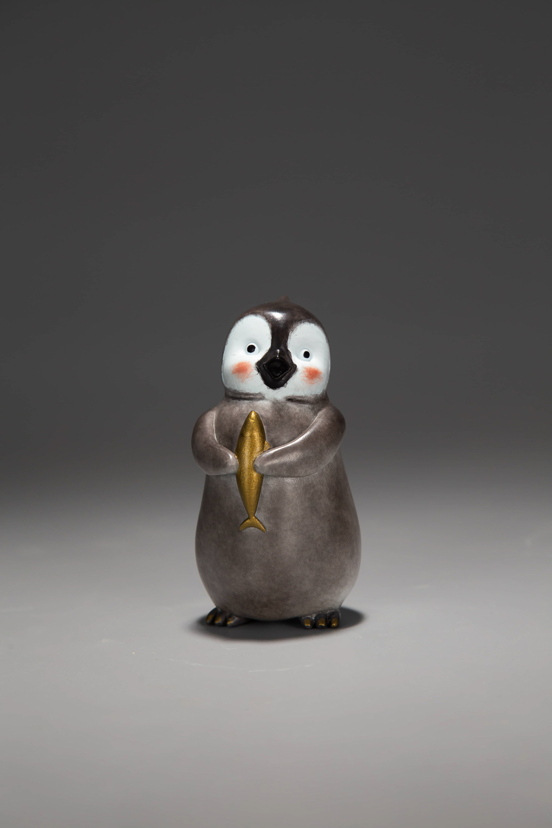 Penguin family (three pieces) — baby penguin with fish.