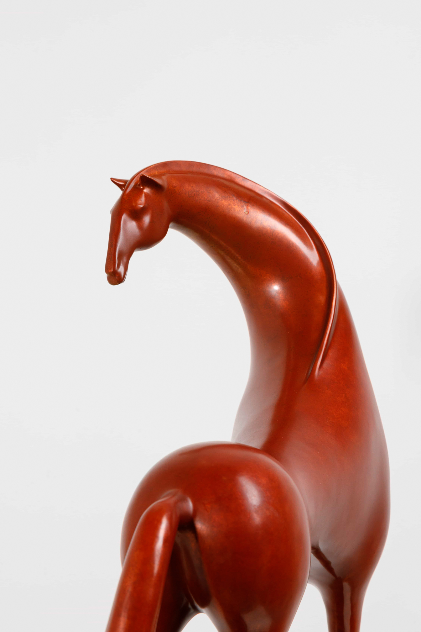 Abstract red horse with elongated legs — head and neck close-up.