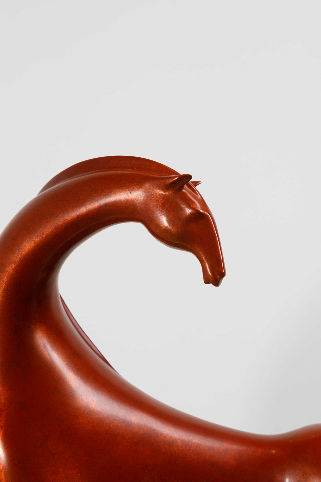 Abstract red horse with elongated legs — head close-up.