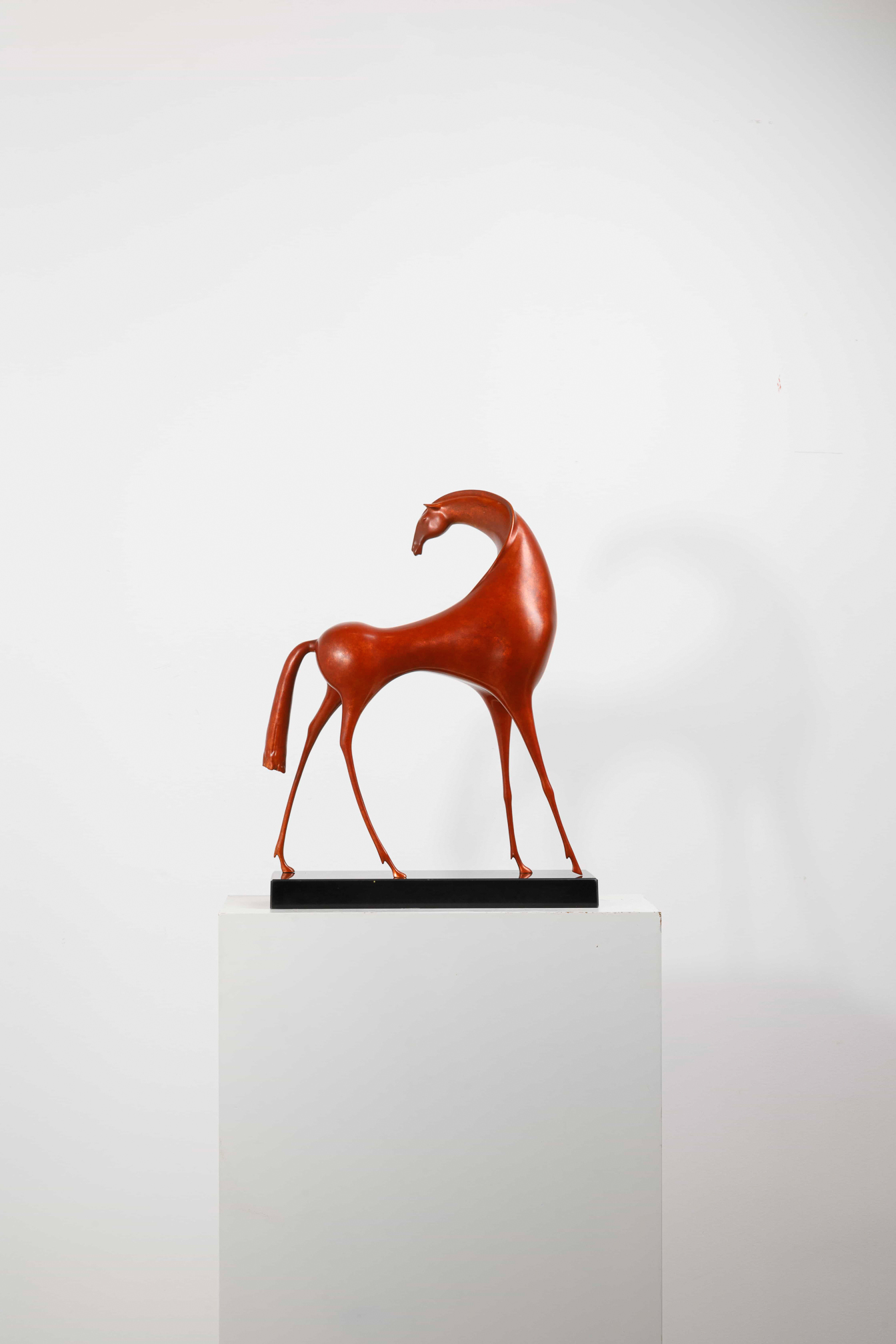 Abstract red horse with elongated legs — plinth alt angle.