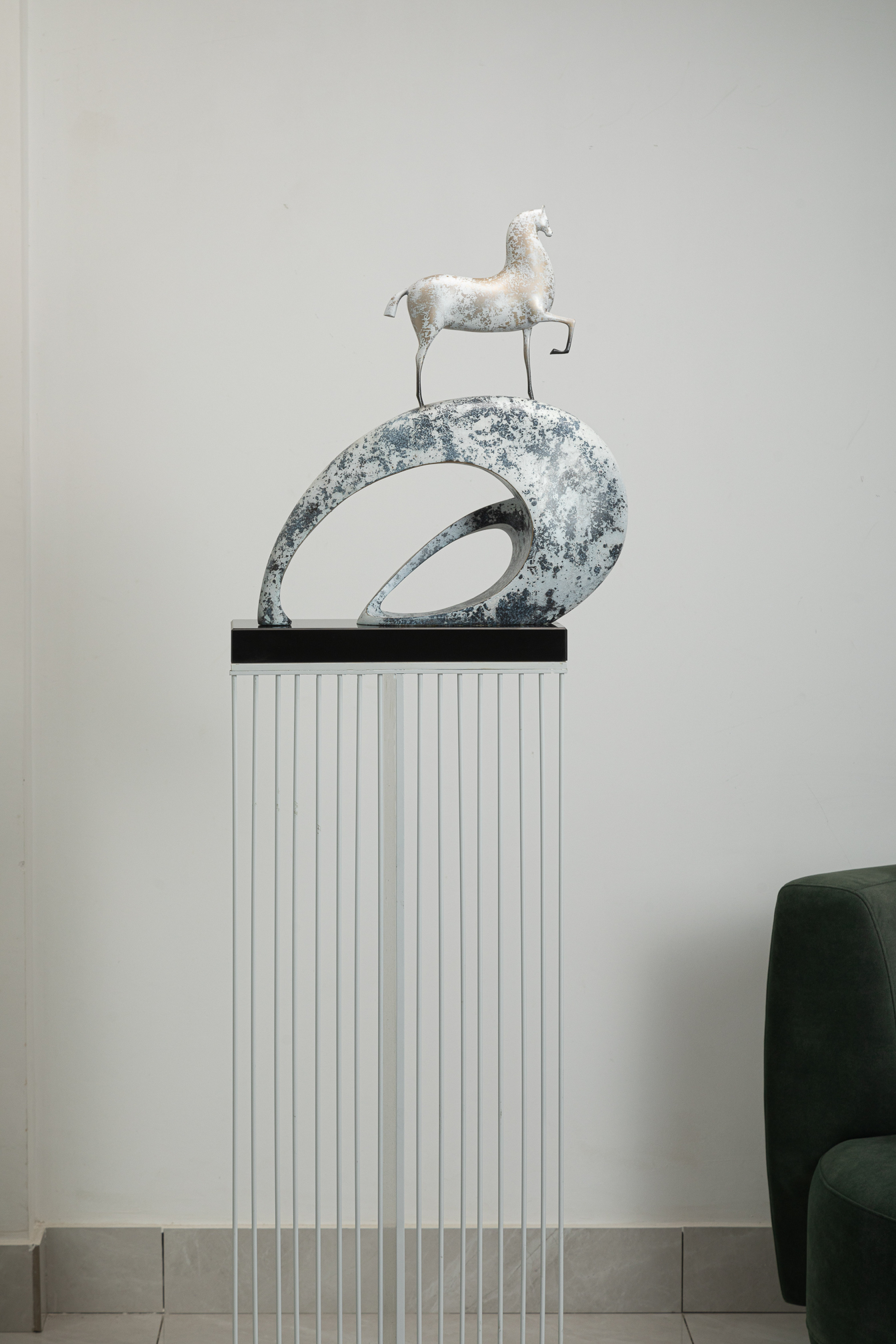 White horse climbing blue-and-white mottled arc base — interior view.