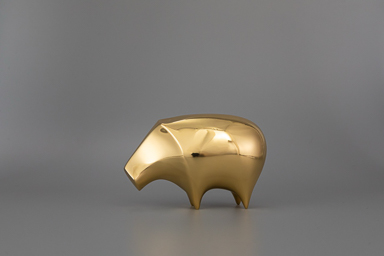 Polished gold rhinoceros (large and small) — single piece view.