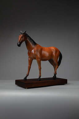 Liver-chestnut horse with black mane on wooden base — front three-quarter.